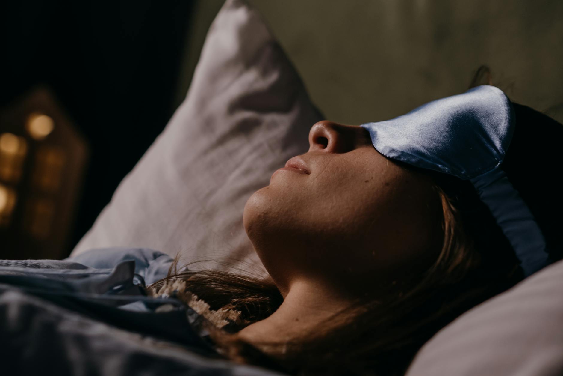 asleep woman wearing eye mask